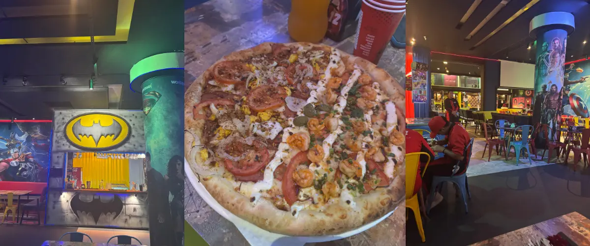 Foto do ambiente da Lucas Pizzaria com o logo do Batman centralizado
